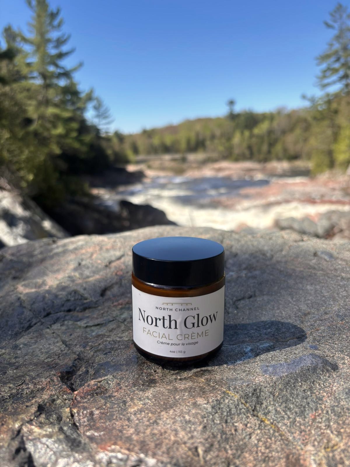 North Glow facial crème on Northern granite above a river in Northern Ontario