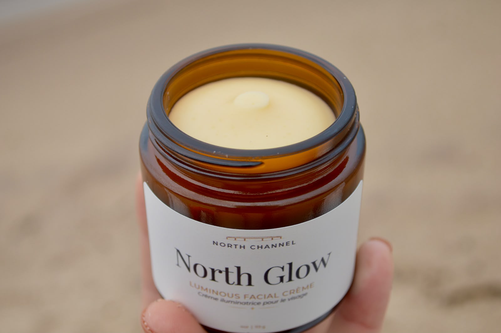 An open jar of North Glow, the surface smooth and level